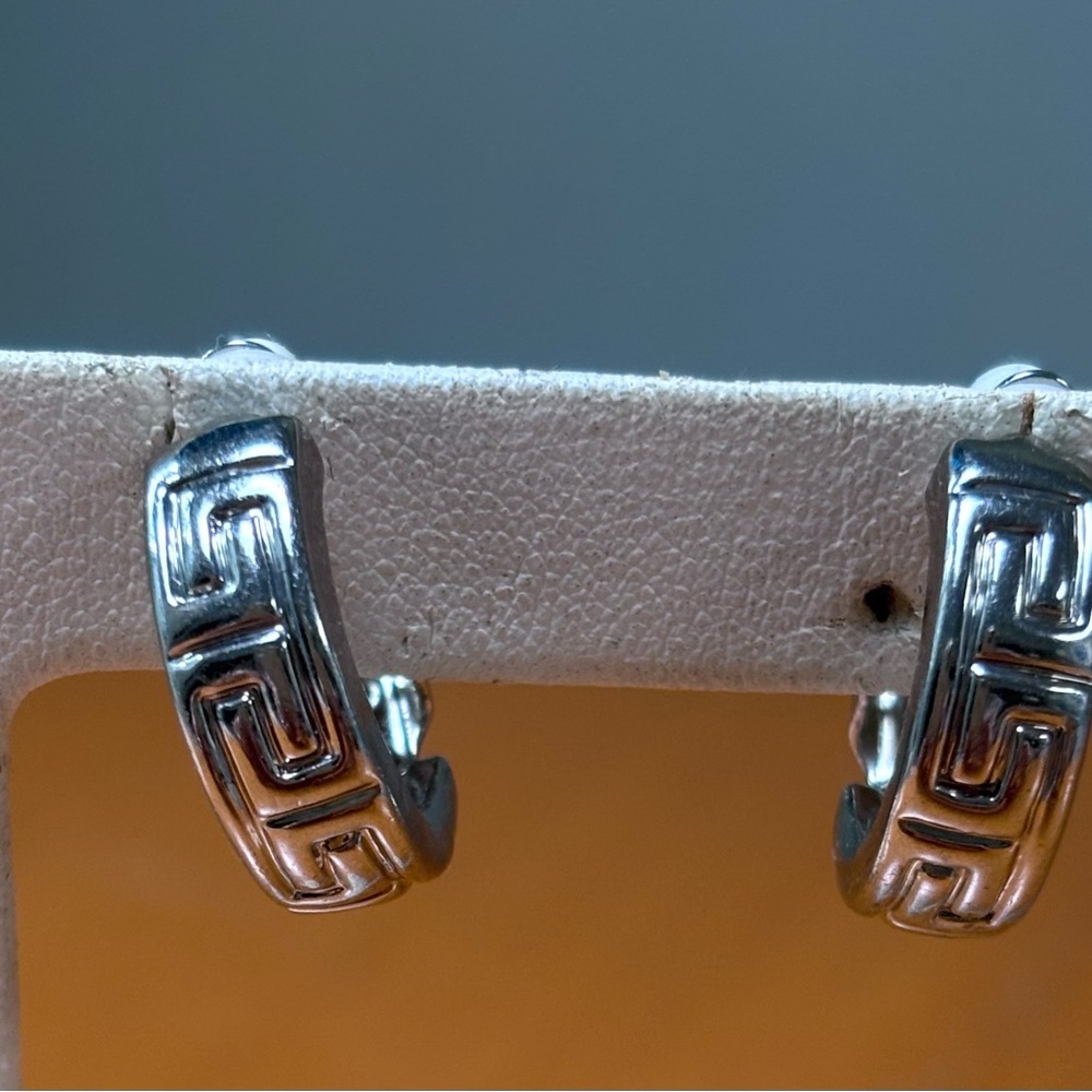 Silver tone huggie earrings